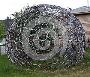 Used bicycle tires forming a globe-like sculpture