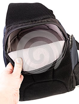Used black and blue fabric camera bag isolated on white background