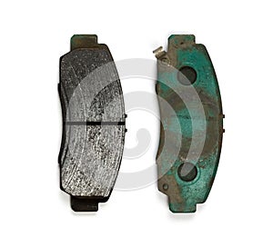 Used brake pads. Close up. Isolated on a white background