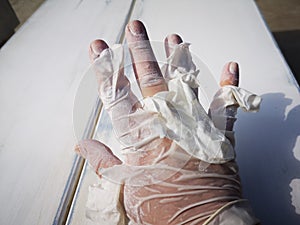 Used broken rubber gloves