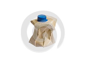 Used Brown milk carton and blue cap isolated