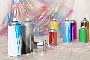 Used cans of spray paint indoors