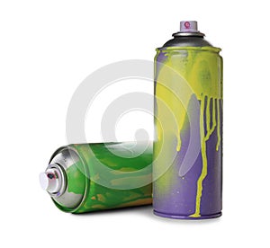 Used cans of spray paints on white background. Graffiti supplies