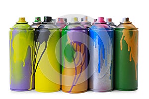 Used cans of spray paints on white background. Graffiti supplies