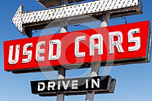 Used Car Drive In neon sign from the 50s at a pre owned car dealership I photo