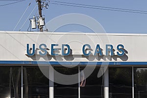 Used Car sign at a pre-owned car dealership. As supplies of new cars dwindle, used cars become more popular photo