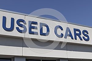 Used Car sign at a pre-owned car dealership. As supplies of new cars dwindle, used cars become more popular photo