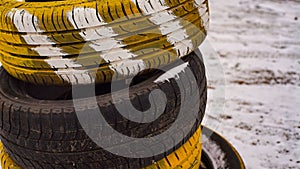 Used car tires on a background of snow.