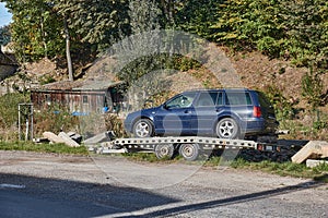 Used car on a trailer photo