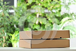 Used cardboard boxes on blurred background.