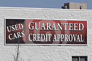 Used Cars - Guaranteed Credit Approval sign at a used car or preowned car dealership photo