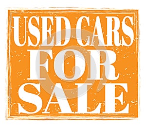 USED CARS FOR SALE, text on orange stamp sign