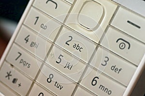 White classic keyboard of the phone in use
