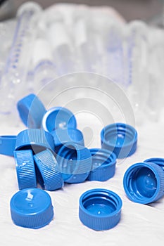 Used centrifuge tubes with blue caps for sample collection and preparation. Biochemical or analytical analysis. Plastic