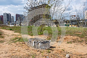 Used checkers with fireworks against the backdrop of a burned-out shopping center. For use in advertising, presentations, and othe