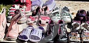 Used child and baby shoes for reusing at flea market