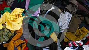Used clothes stacked together background