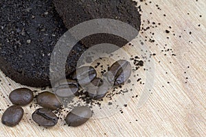 Used coffee grounds after espresso machine and coffee beans