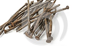 Used crooked rusty nailes on a white. Perseverance and strength