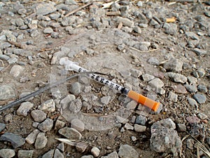Used Drug Needle on the Ground photo