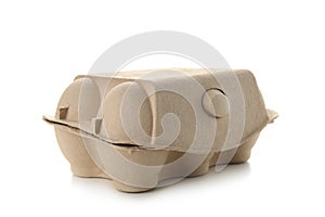 Used egg package on white background. Recycling concept