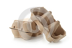 Used egg packages on white background. Recycling concept