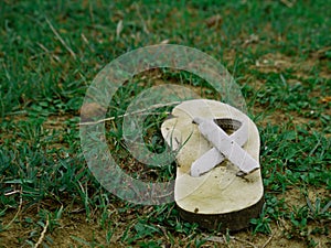 Used foot sleeper wastage material kept on green grass natural field