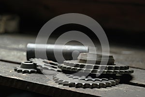 Used gearwheels on a wooden table