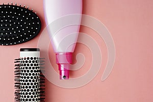 Used Hair brush tools on pink or coral background with copy space. Beauty fashion, hair care background