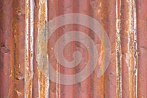 used look of a brown sheet metal on a wall as a graphic element for backgrounds