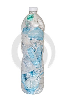 Used masks are stored in plastic water bottles to be disposed of in the trash to prevent the spread of COVID-19 isolated on white