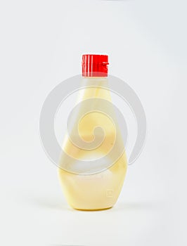 Used mayonnaise bottle on white backgrond, plastic bottle used