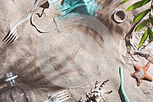 Used medical mask and plastic trash discarded on sandy beach