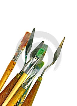 Set of various painting tools, palette knifes and brushes isolated on white background.