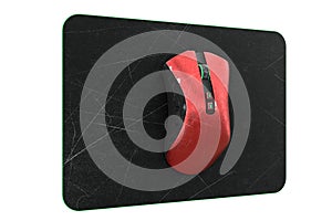 Used metal red gaming mouse with scratches on professional pad isolated on white