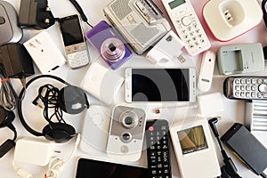 Used modern Electronic gadgets for daily use on White floor, Reuse and Recycle concept