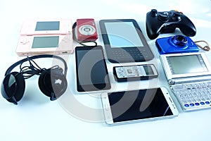 Used modern Electronic gadgets for daily use on wooden floor