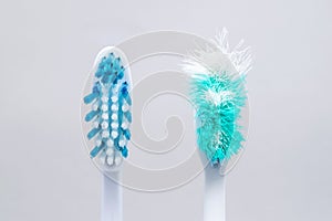 Image of used old and new toothbrushes isolated on a white backg