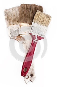 Used paint brushes isolated on white