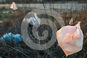 Used plastic bags are lying by the road