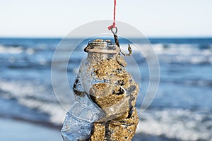 Used plastic bottle in a fish hook