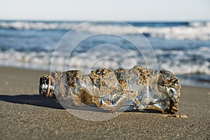 Used plastic bottle on the sand of a beach