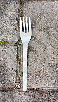 Used plastic fork discarded carelessly