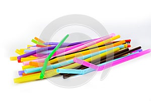 Used plastic straws in a variety of colors