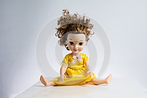 used pretty doll with messed up hair in pretty dress again white backdrop, legs wide open