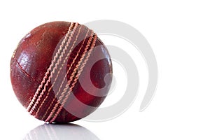 Used red leather cricket ball