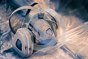 The used respirator lies on the cellophane photo