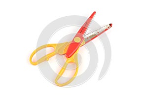 Used serrated color scissors isolated on white background