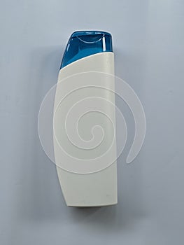 Used shampoo bottle isolated on white background