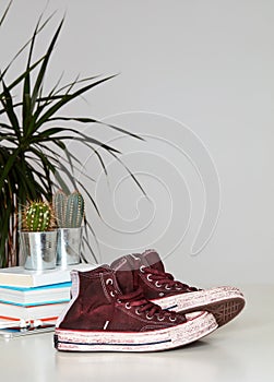 Used shoes on table